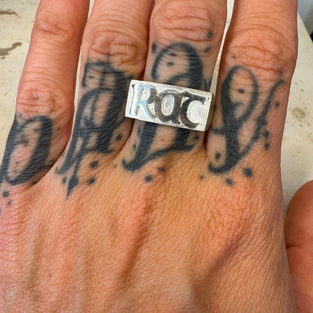 Close-up of the RAT signet ring lettering
