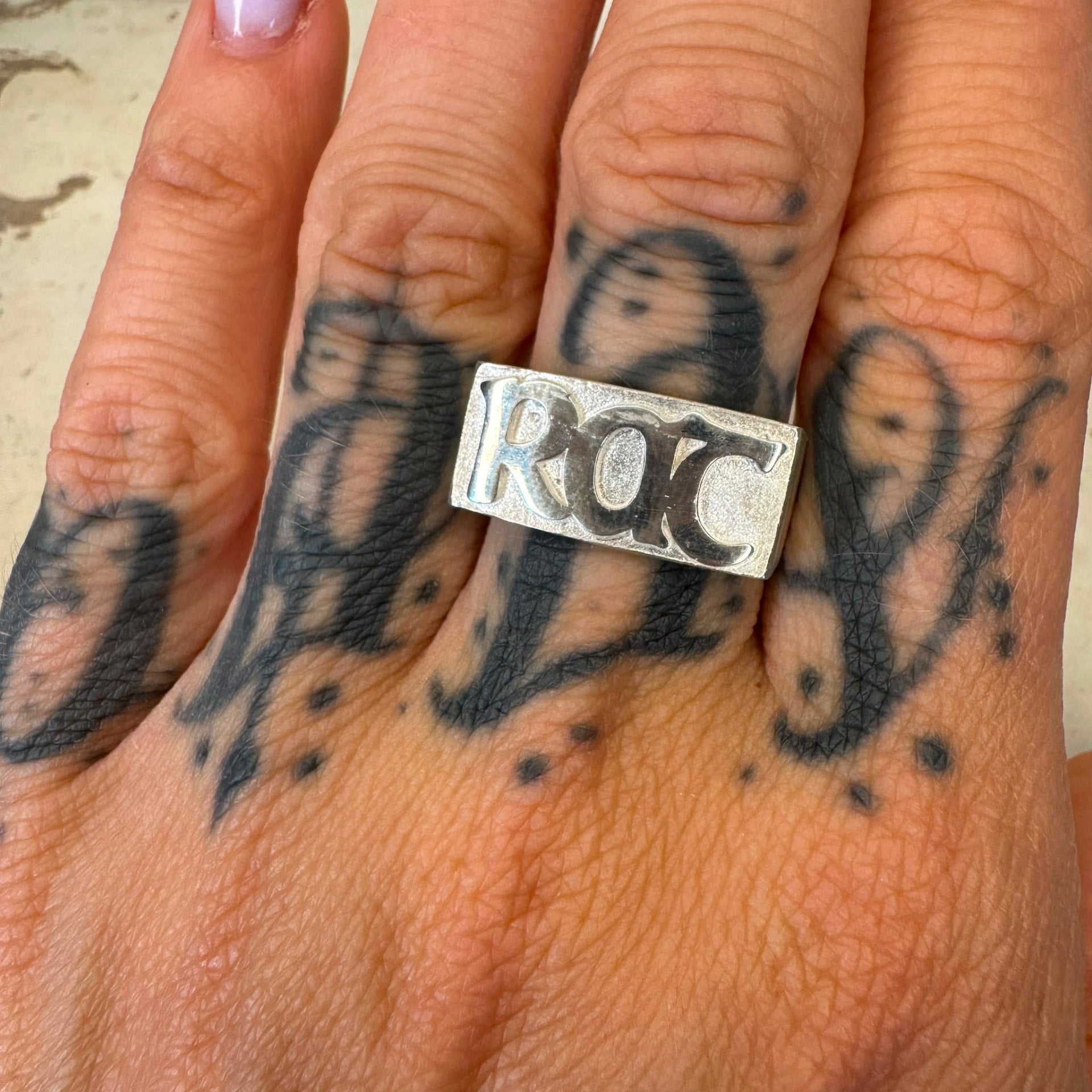 RAT sterling silver signet ring worn on hand