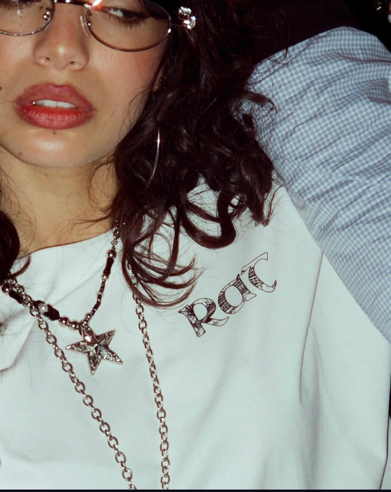 Close-up of the RAT logo printed on the white tee
